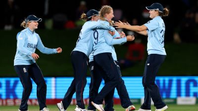 England's Sophie Ecclestone, second right, celebrates with teammates their win over South Africa in their semifinal of the Women's Cricket World Cup cricket match in Christchurch, New Zealand, Thursday, March 31, 2022. (Martin Hunter/Photosport via AP)


