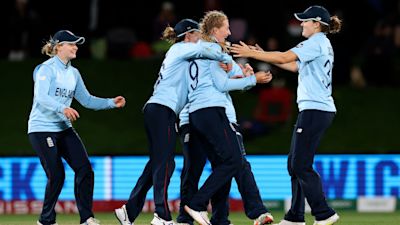 England's Sophie Ecclestone, second right, celebrates with teammates their win over South Africa in their semifinal of the Women's Cricket World Cup cricket match in Christchurch, New Zealand, Thursday, March 31, 2022. (Martin Hunter/Photosport via AP)