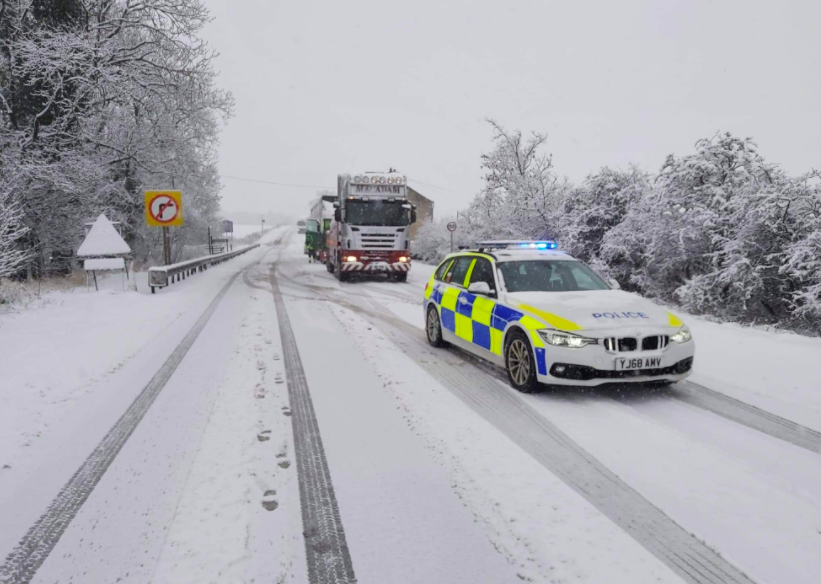 Hundreds of schools closed and travel disruption as heavy snow falls