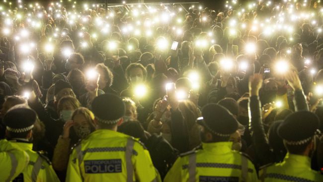 crowd turning on their phone torches in Clapham Common, London, for a vigil for Sarah Everard