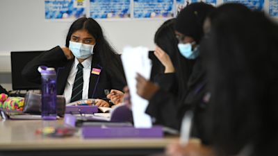 Children wearing facemasks during a lesson at Hounslow Kingsley Academy in West London, as pupils in England return to school for the first time in two months as part of the first stage of lockdown easing. Picture date: Monday March 8, 2021. Kirsty O'Connor/PA