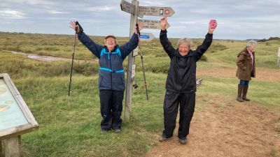 Rosemary Jewers and Rina Adams reach the North Norfolk coast after their 90 mile walk from Essex