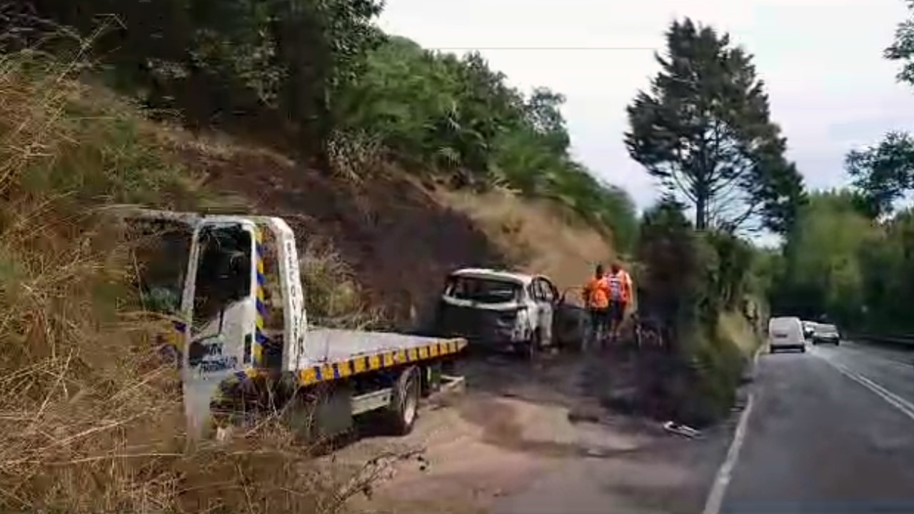 Taxi catches fire and left totally burned out while driving down