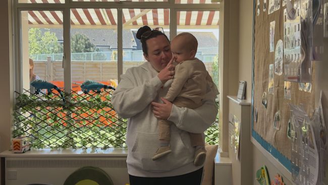 A photo of Ciara with her son in her arms.