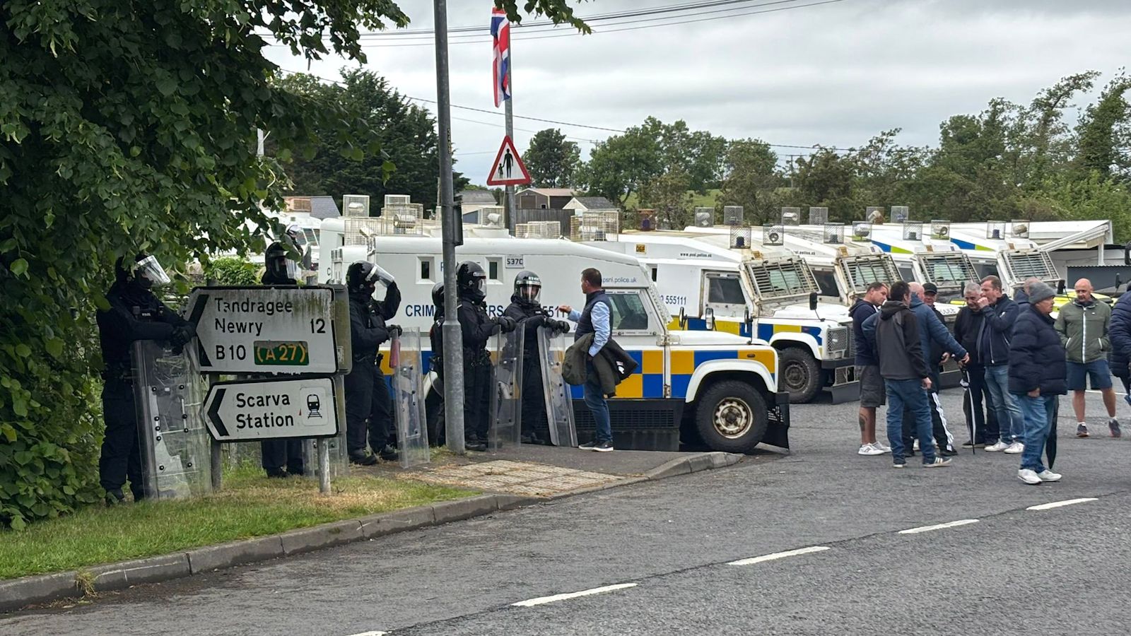 Police operation in Co Armagh village as counter protests take place