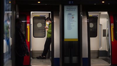 A commuter travelling on the Jubilee Line underground train