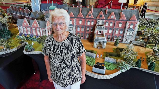 Margaret Seaman in front of her model of Sandringham House.
Credit: PA