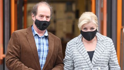 Sandra Durdin, 58, and Trevor Dempsey, 62 from Chingford, leave Thames Magistrates' Court, east London, where they denied flooding their neighbour's alleyway by overwatering plants and putting barbed wire on garden fencing as part of a harassment campaign that lasted for more than a year. Picture date: Thursday December 30, 2021.