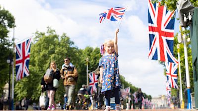 Drew, four, from Norwich, waves her Union flag on The Mall near Buckingham Palace ahead of the Jubilee celebrations.