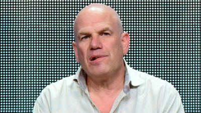 In this July 30, 2015 file photo, producer David Simon appears during the "Show Me a Hero" panel at the HBO 2015 Summer TCA Tour in Beverly Hills, Calif. Simon and Fox News Channel host Sean Hannity are tossing vulgarities at each other on social media. Simon, who made “The Wire,” sent out a mocking tweet about Hannity hosting a Donald Trump town hall meeting about issues confronting black America. (Photo by Richard Shotwell/Invision/AP, File)