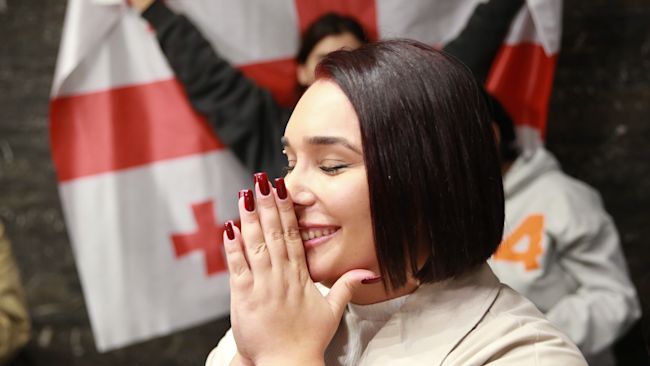 A supporter of the Coalition for Change after polls closed at the parliamentary election in Tbilisi, Georgia on Saturday. AP