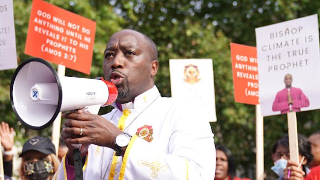 Bishop Climate Wiseman, 46, speaks to his supporters outside Inner London Crown Court, where he is charged with fraud and unfair trading offences over the selling of 'plague protection kits' with claims a mixture made from oil and red string, was a cure for Covid-19. Picture date: Monday September 13, 2021.