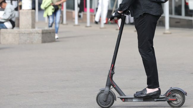 Stock image of an e-scooter rider. Credit: Press Association