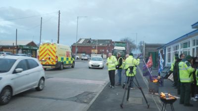Ambulance rushes away from picket line to attend ill child amid