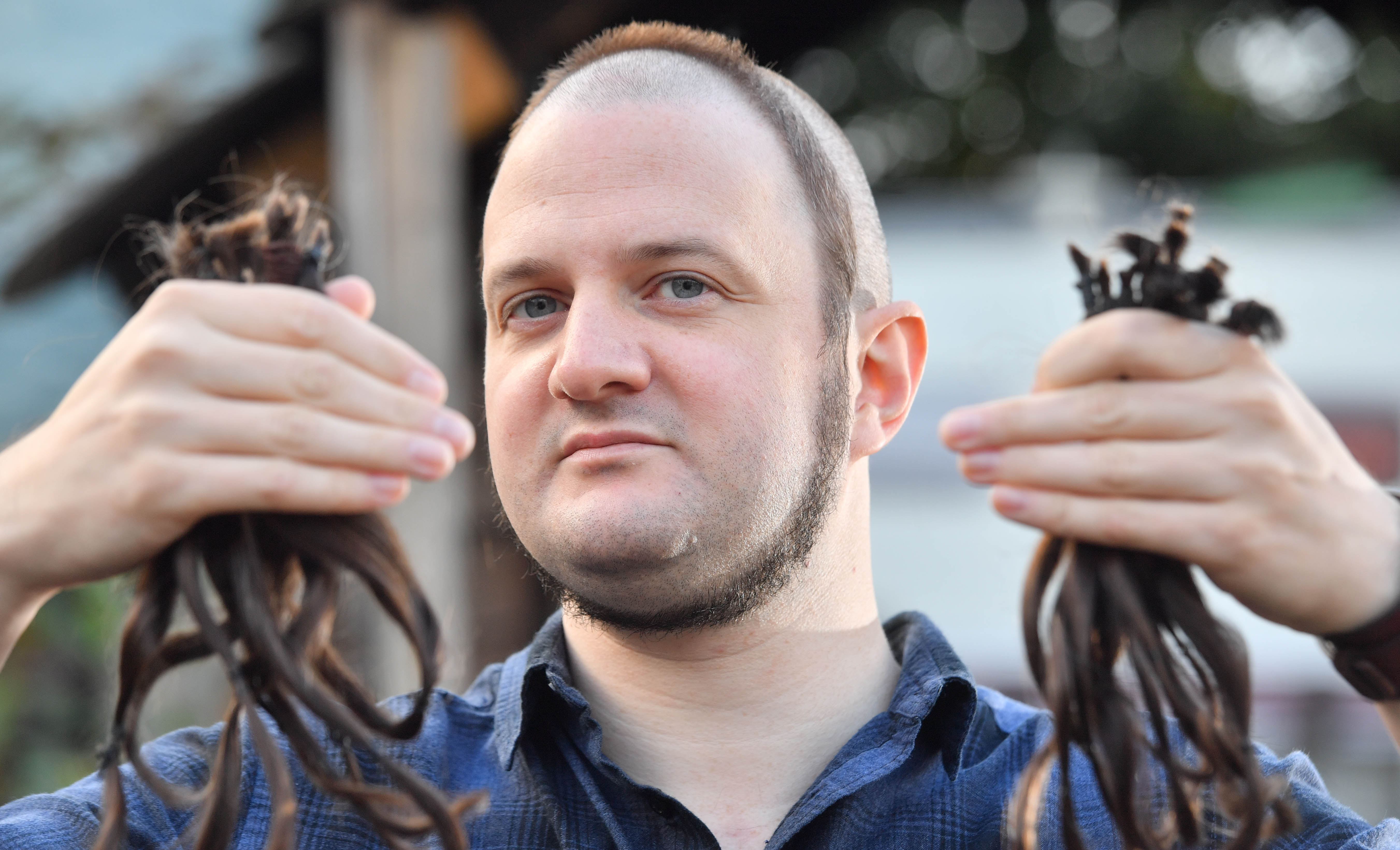 The heartfelt reason behind Cardiff man's bizarre haircut that's seen him  dubbed 'Ring Head' | ITV News Wales