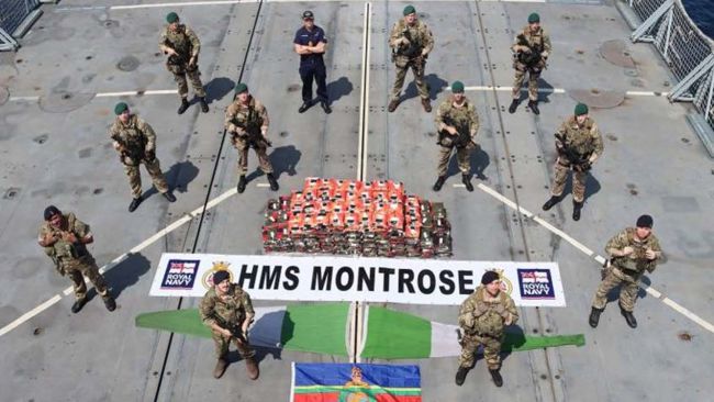 211020-HMS Montrose crew with drugs seized from operation-Royal Navy