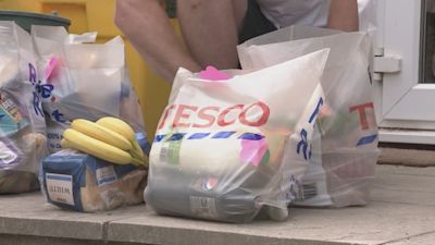Bags full of food shopping on doorstep.