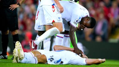 Crystal Palace's Joachim Andersen lies on the ground after being fouled by Liverpool's Darwin Nunez.  