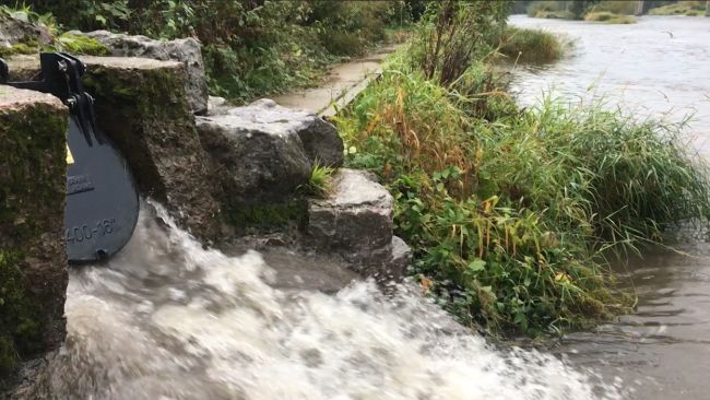 A storm drain releases sewage into the River Wye.