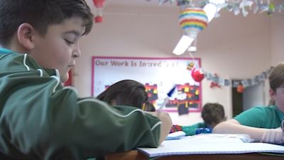 tomas rice school student writing in class