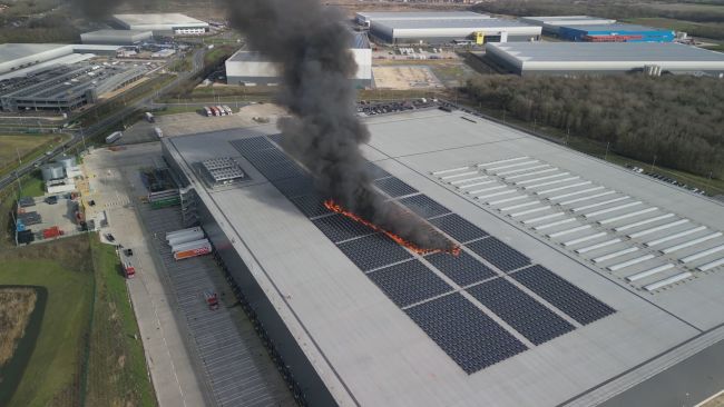 A fire started on solar panels on the roof of a Lidl warehouse in Peterborough.