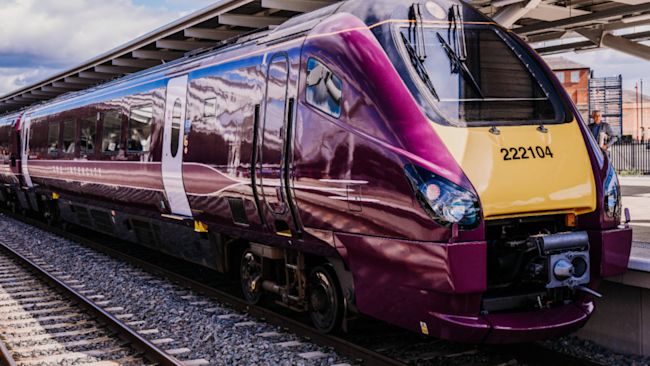 A purple express train at a station