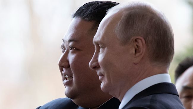Russian President Vladimir Putin, right, and North Korea's leader Kim Jong Un