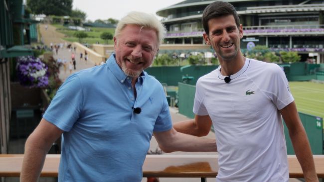 Novak Djokovic, right, poses for a television camera during an interview with former tennis champion Boris Becker, left, at Wimbledon in 2018.