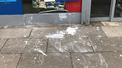 Paint on ground outside shop