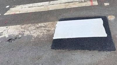 One stripe of a pedestrian crossing has been partially painted in Cornwall