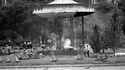 Police and firemen at the still-smouldering bandstand in Regents Park, London, following the IRA bomb blast that killed six people and left many others seriously injured.
