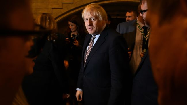 Prime Minister Boris Johnson alongside the newly elected Conservative MPs at the Houses of Parliament in Westminster, London, after the party gained an 80-seat majority in the General Election.  Leon Neal/PA . 16-Dec-2019