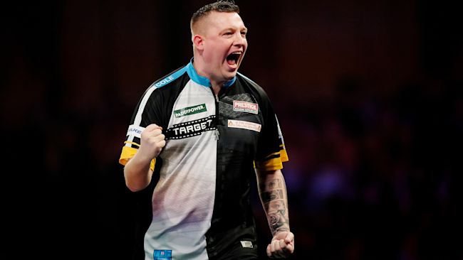 Chris Dobey celebrates winning their quarter final match against Gerwyn Price on day fourteen of the Paddy Power World Darts Championship at Alexandra Palace, London. Picture date: Wednesday January 1, 2025.
