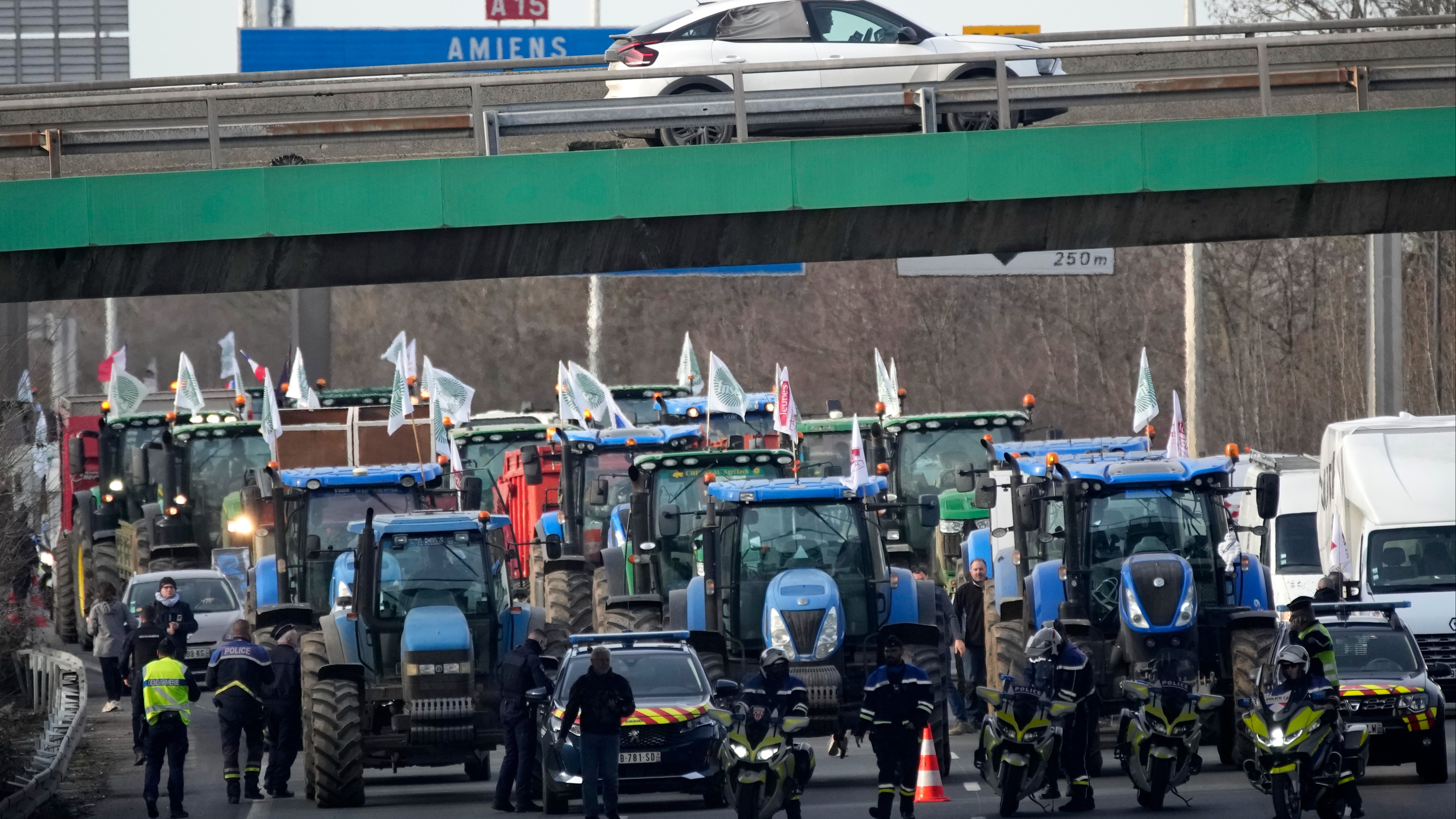 'Under Siege': French Farmers Encircle Paris On Tractors In Protest ...