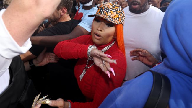 Nicki Minaj is mobbed by fans as she arrives at Cafe Koko in Camden, north west London, where she announced she will be holding a meet and greet whilst she is visiting the UK. Picture date: Monday July 11, 2022.
