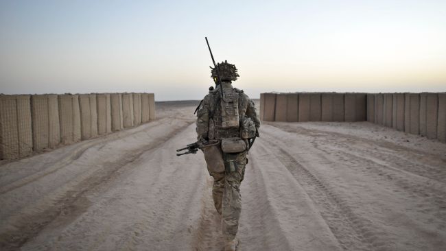 A British soldier going on foot patrol in Afghanistan.