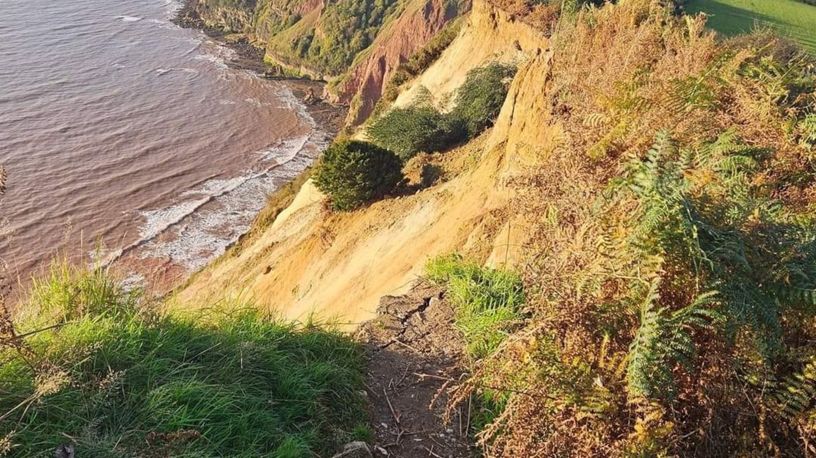 Clifftop coastal path collapses into sea at Beer in Devon | ITV News ...
