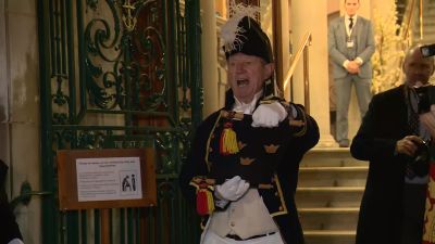 A town crier proclaims Colchester's new city status.