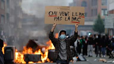 French students set schools on fire in nationwide protests over education system