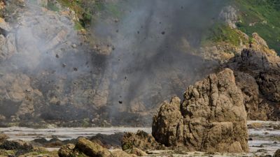 Pictures of a controlled explosion of a WWII grenade in Guernsey