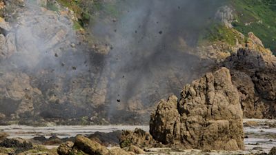 Pictures of a controlled explosion of a WWII grenade in Guernsey