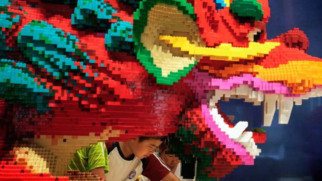 Credit: AP

Lego dragon with young boy. Lego sustainability. 