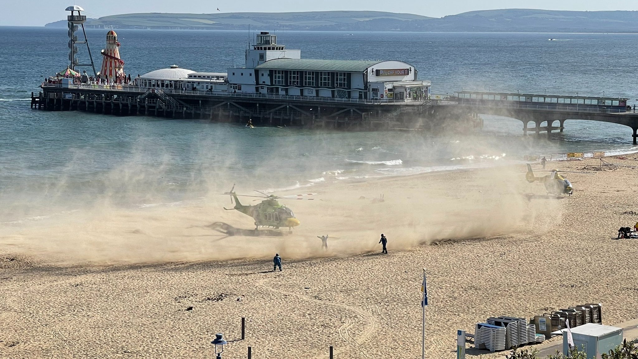 Two people taken to hospital after being pulled from sea at