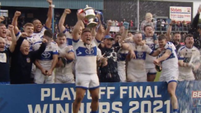 Workington Town celebrate after winning promotion to rugby league's Championship promotion. ITV Border,10/10/21.