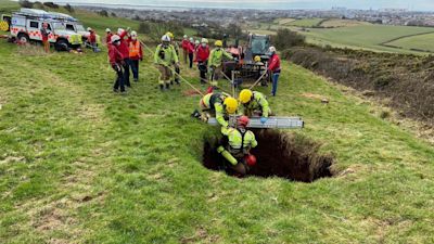 Firefighters and paramedics saved a quad biker who fell down a sink hole