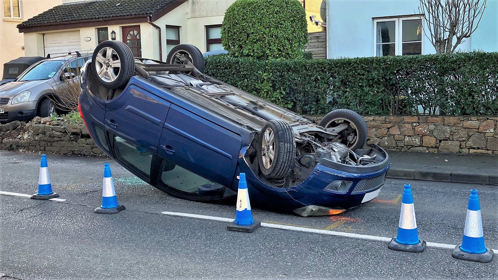 Driver taken to hospital after car overturns and ends up on roof in St