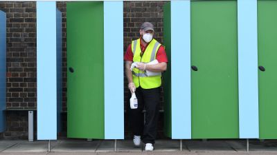 A member of staff cleans changing rooms at Charlton Lido Saturday 11 July.