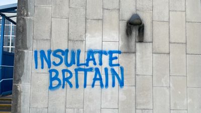 The words 'Insulate Britain' spray-painted onto the edifice of Crawley Magistrate's court after nine climate activists appeared on Monday charged with causing a public nuisance