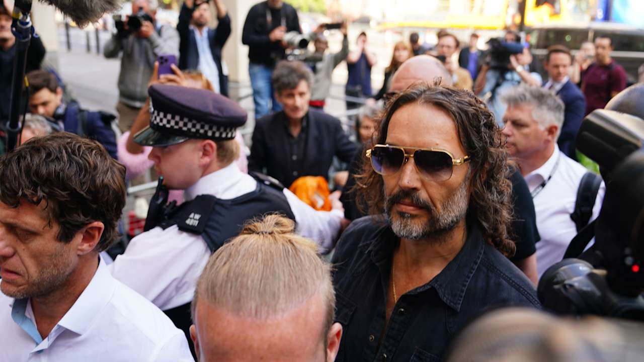 Russell Brand arrives at court to face rape and sexual assault charges