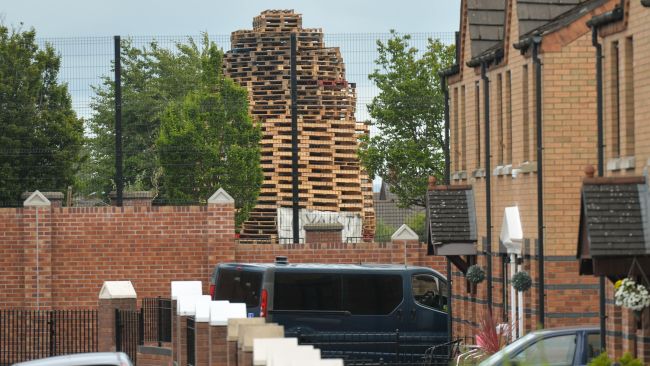 A controversial bonfire built next to the Peace Wall between the Loyalist Tigers Bay area and the Nationalist Newlodge area of Belfast seen ahead of the July 11th celebration organized by members of the Loyalists Orders. The bonfire consists of pallets collected by the Loyalists to mark the opening of the annual Orange Parade on July 12. The parade celebrates the victory of the Protestant King William of Orange over the Catholic King James II at the Battle of Boyne in 1690. On Sunday, 11 July 2021, in Belfast, County Antrim, Northern Ireland (Photo by Artur Widak/NurPhoto)
Read less
Picture by: Artur Widak/NurPhoto/PA Images
Date taken: 11-Jul-2021